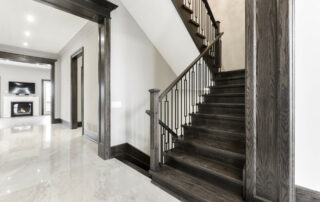 Hall's Lake Estates Luxury Model Home Hand Crafted Oak stairway